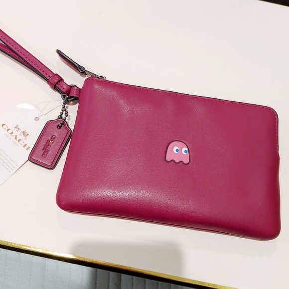Coach Handbags - Coach x Pac Man fuchsia clutch